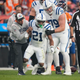 Indianapolis Colts running back Nyheim Hines (21) is helped up after being injured against the Denver Broncos during the first half of an NFL football game, Thursday, Oct. 6, 2022, in Denver.